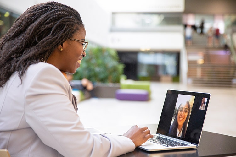 Happy,Female,Office,Friends,Talking,Through,Video,Call.,Business,Women Happy female office friends talking through video call. Business women using digital devices for video chat. Internet connection concept
