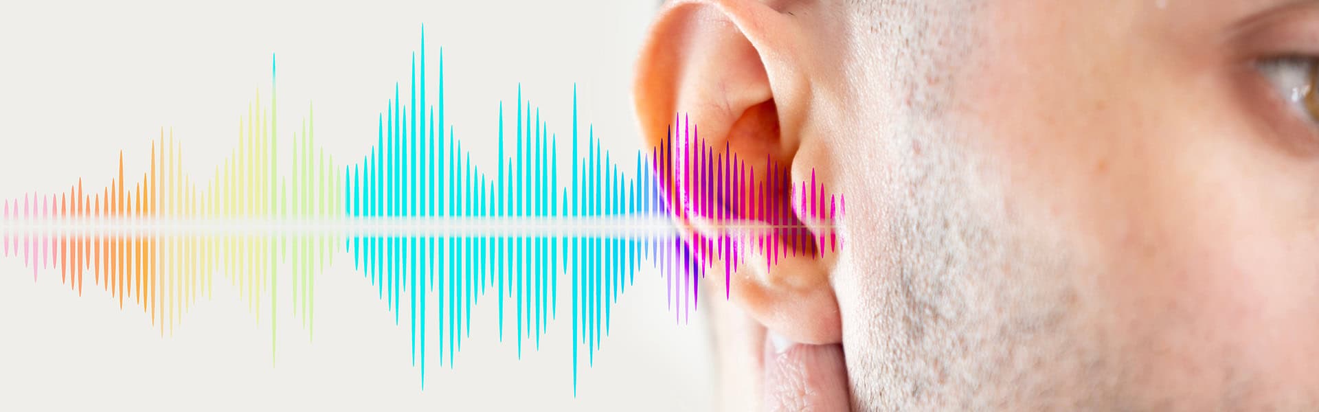 young man ear closeup with sound waves / shutterstock.com